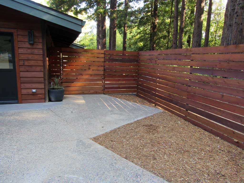 Custom entry fencing framing a property