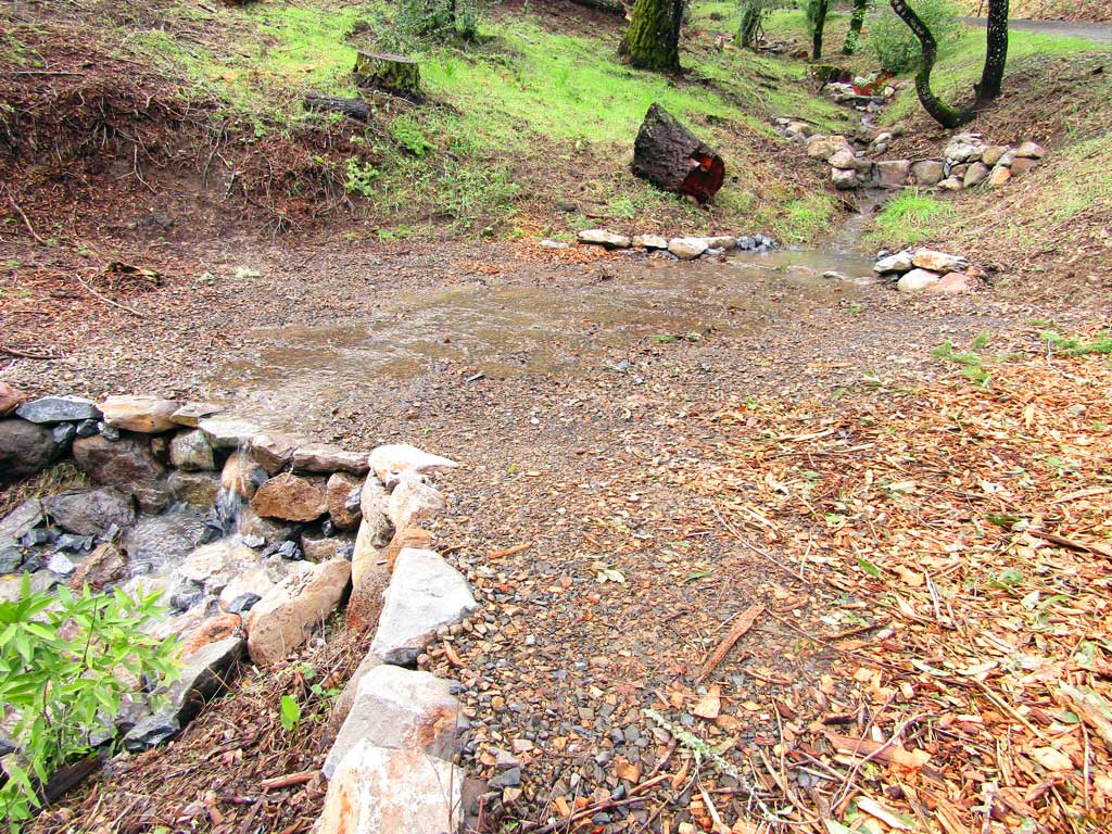 Stabilized trail crossing over a restored gully