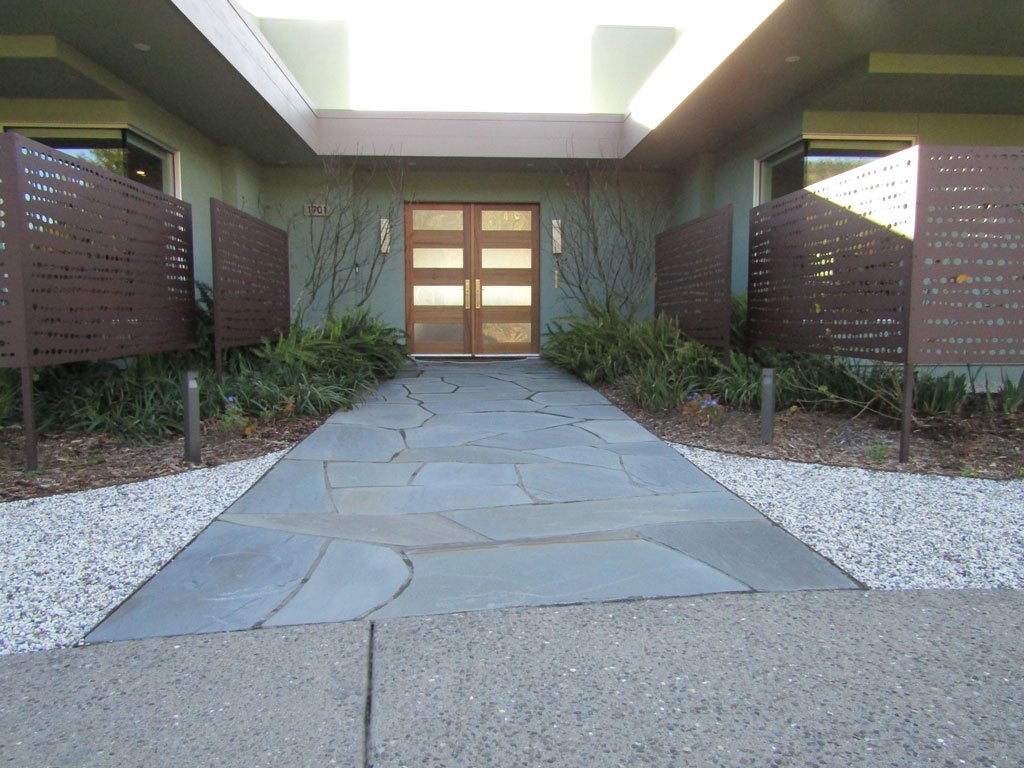 Flagstone entry path leading to a home