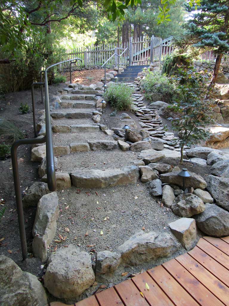 Stone flatwork and steps in a finished landscape