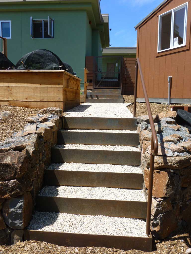 Custom stair and railing details in a landscaped garden