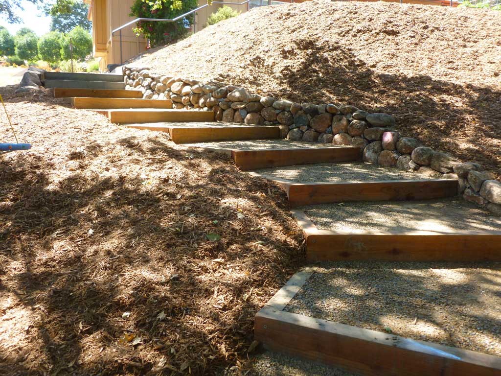 Redwood and gravel steps set into a hillside